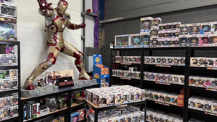 Inside The Geek In Me shop in Willington, with a life-size Iron Man statue and shelves of Funko Pops